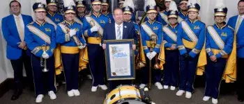 Council Member Koretz standing with the UCLA Band